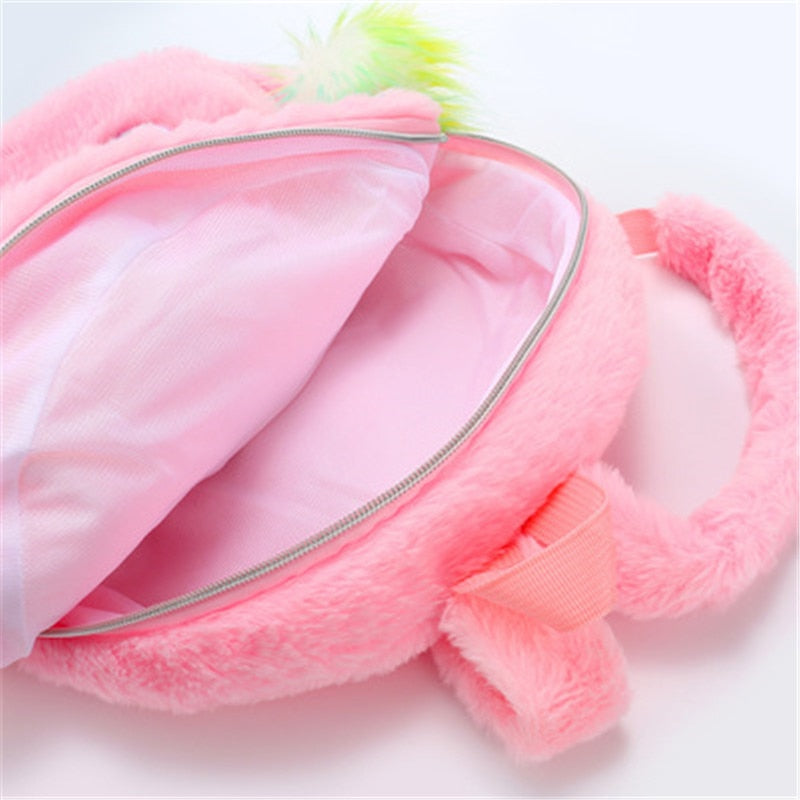 Intérieur sac licorne toux doux rose avec pompon jaune